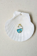 Oval blue & white sailboat charm
