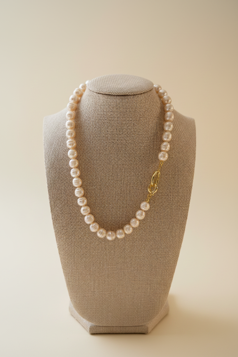 Pearl Necklace on Bust with Ivory Background